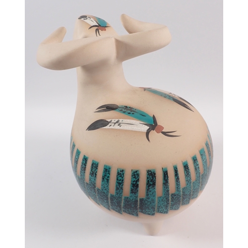 19 - A Native American stylised pottery buffalo painted traditional feather dress decoration, 22cm tall p... 
