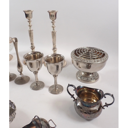 225 - A collection of silver plate, including candlesticks, cruets in the form of chicks, goblets, etc