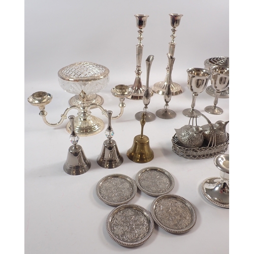 225 - A collection of silver plate, including candlesticks, cruets in the form of chicks, goblets, etc