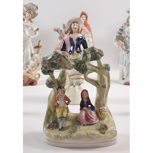 24 - A pair of Victorian Staffordshire dogs, 25cm tall and various Staffordshire groups etc.