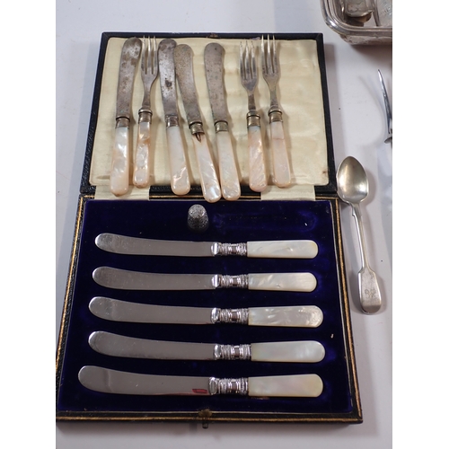 242 - A group of silver plated items including water jug, serving dish, cutlery etc.