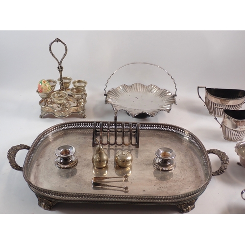 243 - A silver plated two handled tray, an eggcup stand and other silver plated items including WMF candle... 