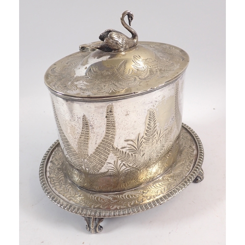 246 - A Victorian silver plated biscuit barrel, decorated ferns and swan finial, 21cm tall, a brass trinke... 