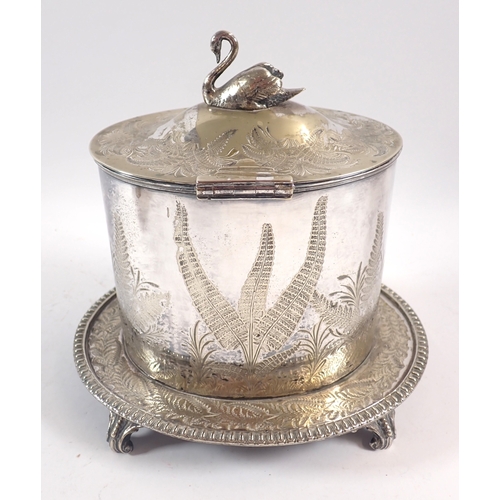 246 - A Victorian silver plated biscuit barrel, decorated ferns and swan finial, 21cm tall, a brass trinke... 