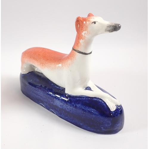 25 - A Staffordshire deer spill vase, a faun and two greyhound groups - all damaged except one greyhound,... 