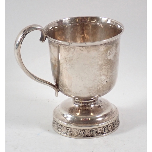 273 - A Jones, Lows & Ball American white metal mug on pedestal floral foot, 10.5cm tall, 142g