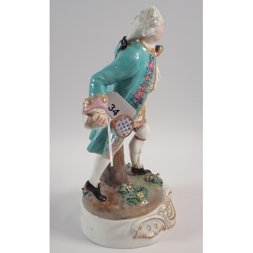 34 - A 19th century Meissen style porcelain figure of a tennis player with double crossed swords mark to ... 