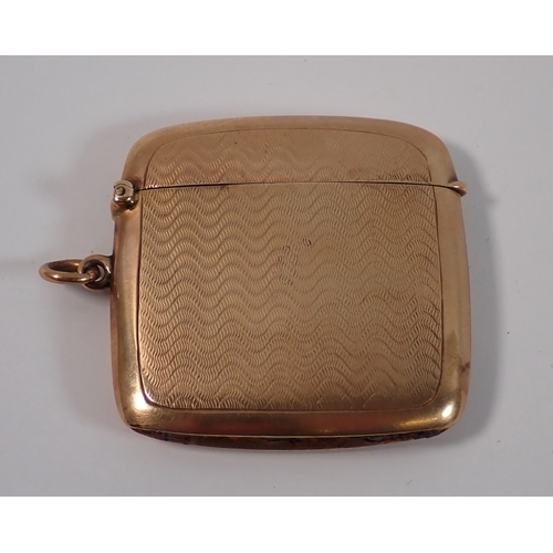 373 - A 9ct gold vesta case with engine turned decoration, London 1924, 4.5cm long, 19g