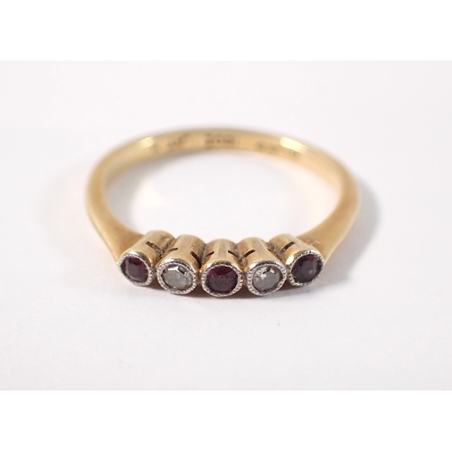 379 - An Edwardian 18ct gold ring set three rubies and two diamonds, size J/K, 1.8g