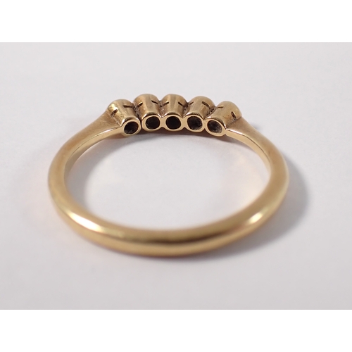 379 - An Edwardian 18ct gold ring set three rubies and two diamonds, size J/K, 1.8g