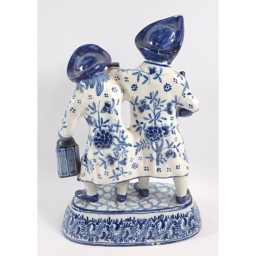 38 - A Delft blue and white inebriated vicar and Moses and figure group, 29cm tall