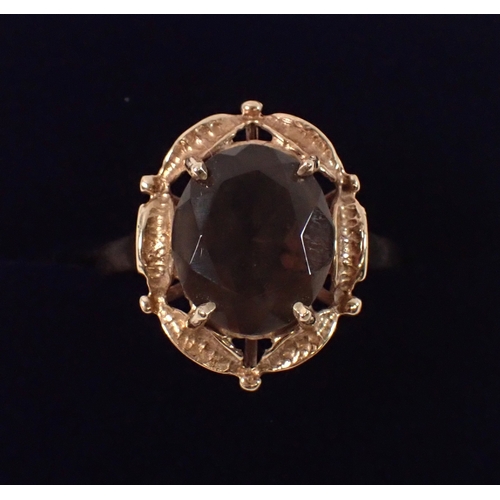 381 - A 9ct gold ring set oval smoky quartz, size Q-R, 3.9g