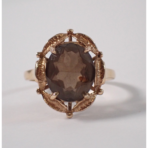 381 - A 9ct gold ring set oval smoky quartz, size Q-R, 3.9g