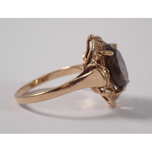381 - A 9ct gold ring set oval smoky quartz, size Q-R, 3.9g