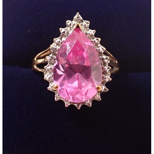 383 - A 9ct gold ring set tear drop cut pink synthetic sapphire, size M-N, 3.4g