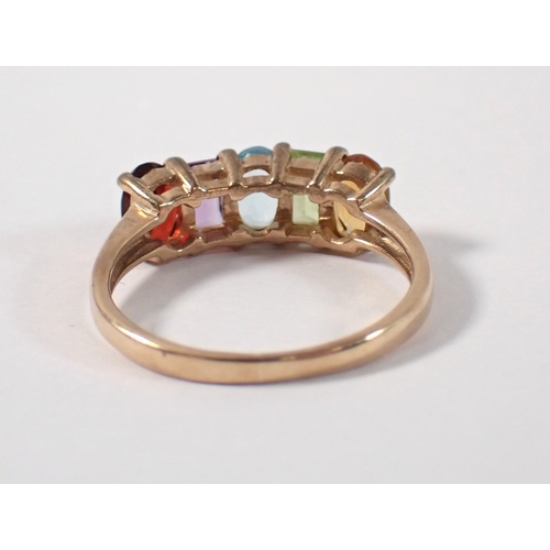 384 - A 9ct gold multi gemstone ring size O, 2.7g