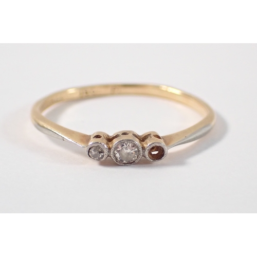 387 - An 18ct gold platinum three stone diamond ring, one diamond deficient, size P-Q, 1.5g