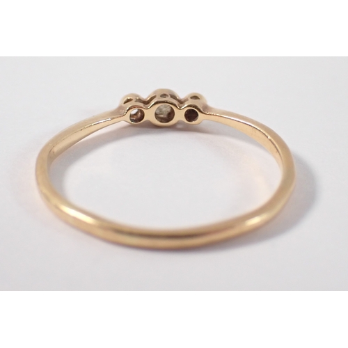 387 - An 18ct gold platinum three stone diamond ring, one diamond deficient, size P-Q, 1.5g