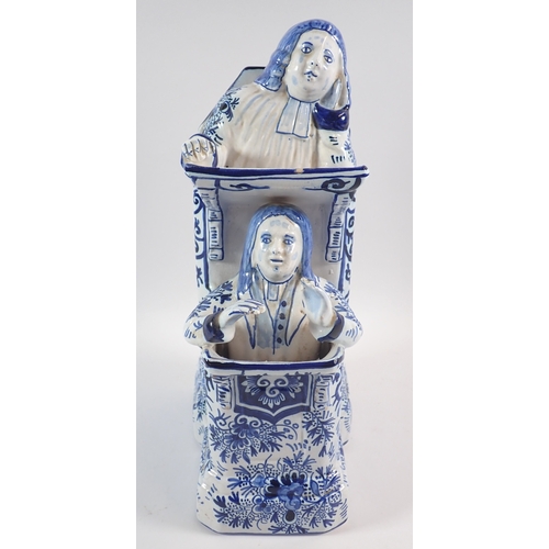 39 - A Delft vicar and Moses group in blue and white, 31cm tall