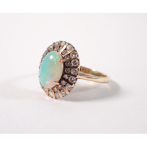 393 - A 14ct gold ring set oval opal within two rows of graduated diamonds, size L, opal 10 x 7mm, 4g
