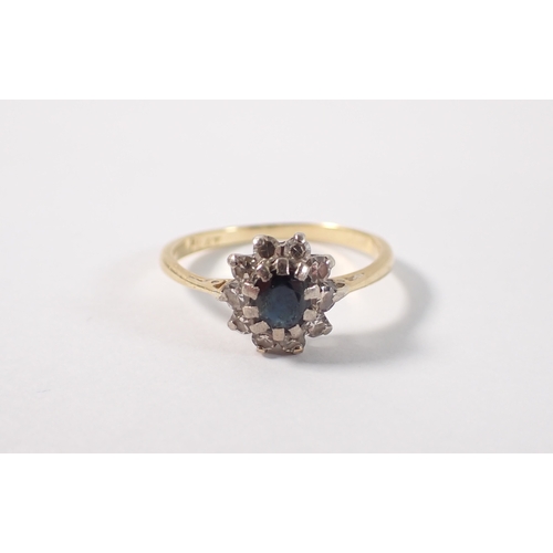 394 - An 18ct gold and platinum sapphire and diamond cluster ring, size M, 2.2g