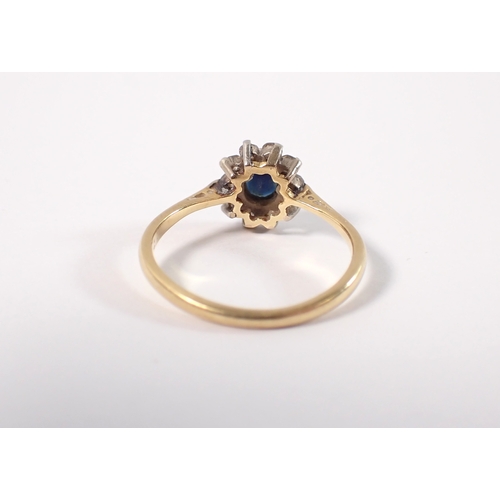 394 - An 18ct gold and platinum sapphire and diamond cluster ring, size M, 2.2g