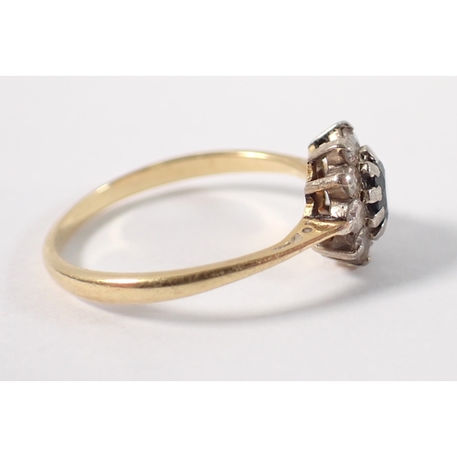 394 - An 18ct gold and platinum sapphire and diamond cluster ring, size M, 2.2g