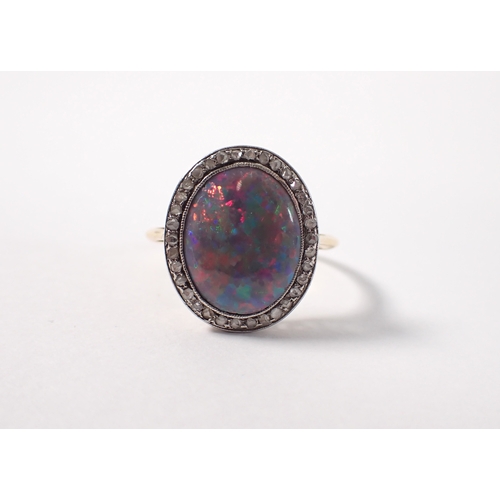 395 - An antique gold ring set black opal within old cut  diamond surround, size M-N, 3g, opal is 14mm x 1... 