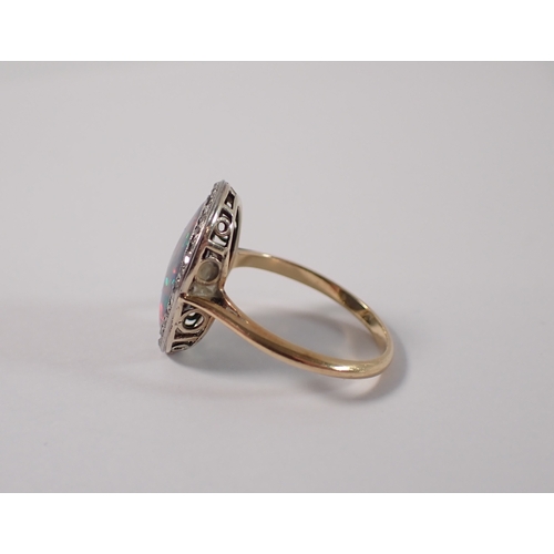 395 - An antique gold ring set black opal within old cut  diamond surround, size M-N, 3g, opal is 14mm x 1... 