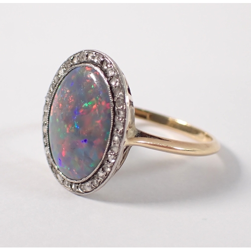 395 - An antique gold ring set black opal within old cut  diamond surround, size M-N, 3g, opal is 14mm x 1... 