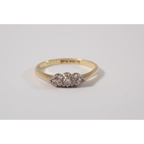 396 - An 18ct gold ring set three diamonds, size L, 1.7g