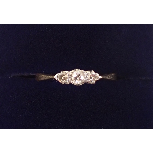 396 - An 18ct gold ring set three diamonds, size L, 1.7g