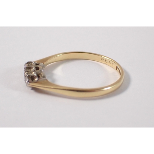 396 - An 18ct gold ring set three diamonds, size L, 1.7g