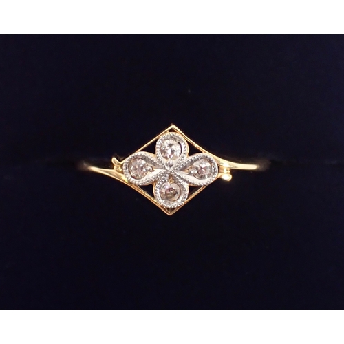 397 - An Art Deco 18ct gold ring set four diamonds in a quatrefoil head, size N, 2g