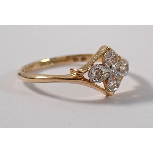 397 - An Art Deco 18ct gold ring set four diamonds in a quatrefoil head, size N, 2g