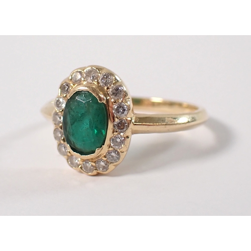 399 - An 18ct gold ring set emerald within diamond surround, size M, 3g
