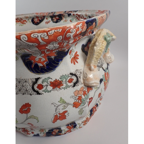 4 - A Victorian Fenton ironstone footbath with dolphin handles and floral printed decoration, 46cm wide