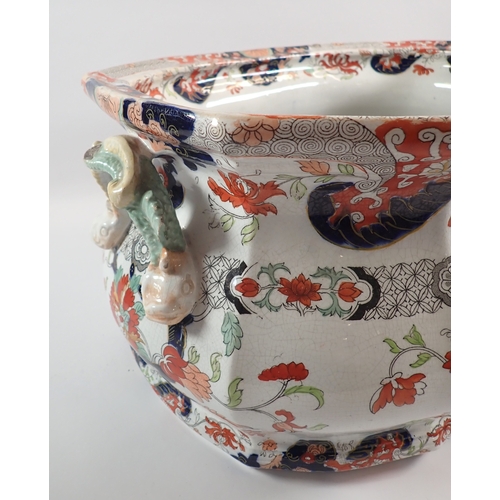 4 - A Victorian Fenton ironstone footbath with dolphin handles and floral printed decoration, 46cm wide