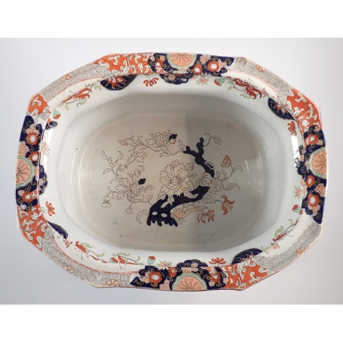 4 - A Victorian Fenton ironstone footbath with dolphin handles and floral printed decoration, 46cm wide