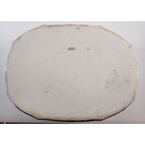4 - A Victorian Fenton ironstone footbath with dolphin handles and floral printed decoration, 46cm wide