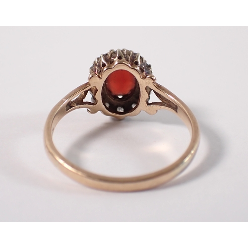 400 - A 9ct gold ring set garnet within diamond surround, size P, 3g