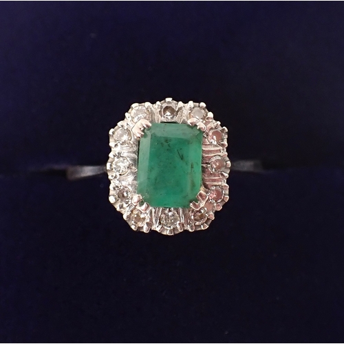 409 - An antique 18 carat white gold ring set emerald within illusion set diamond surround, size M, emeral... 
