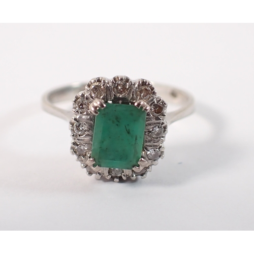 409 - An antique 18 carat white gold ring set emerald within illusion set diamond surround, size M, emeral... 