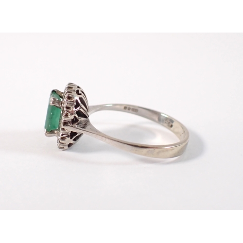 409 - An antique 18 carat white gold ring set emerald within illusion set diamond surround, size M, emeral... 