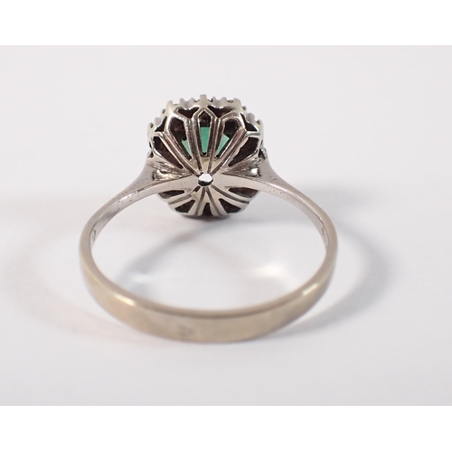 409 - An antique 18 carat white gold ring set emerald within illusion set diamond surround, size M, emeral... 