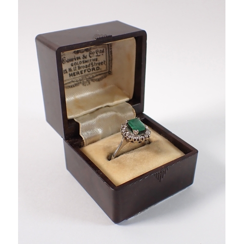 409 - An antique 18 carat white gold ring set emerald within illusion set diamond surround, size M, emeral... 