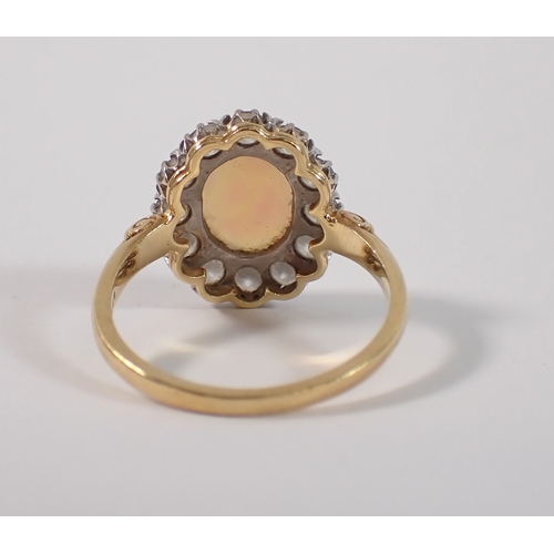 413 - An 18ct gold oval cut opal ring with diamond surround, size P, opal 10 x 8mm, diamonds 3mm, 4.2g, ma... 