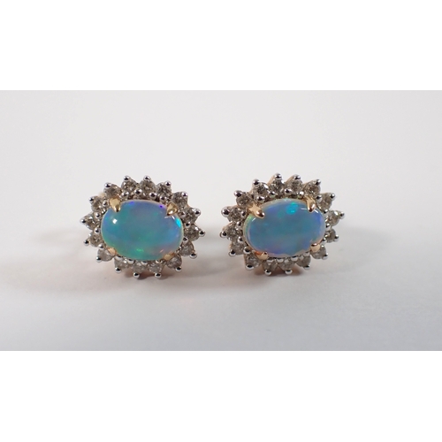 415 - A pair of 14ct gold opal and diamond cluster earrings, opals 7 x 5mm, 3.2g