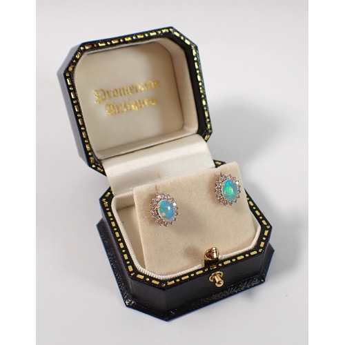 415 - A pair of 14ct gold opal and diamond cluster earrings, opals 7 x 5mm, 3.2g