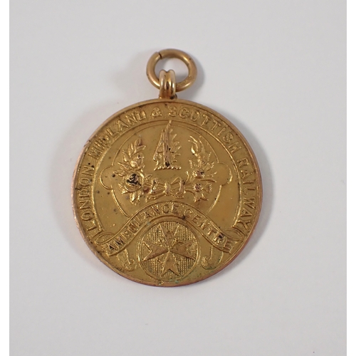 417 - A 9ct gold London Midland and Scottish Railway Ambulance Centre medal for long service, 2.6cm diamet... 